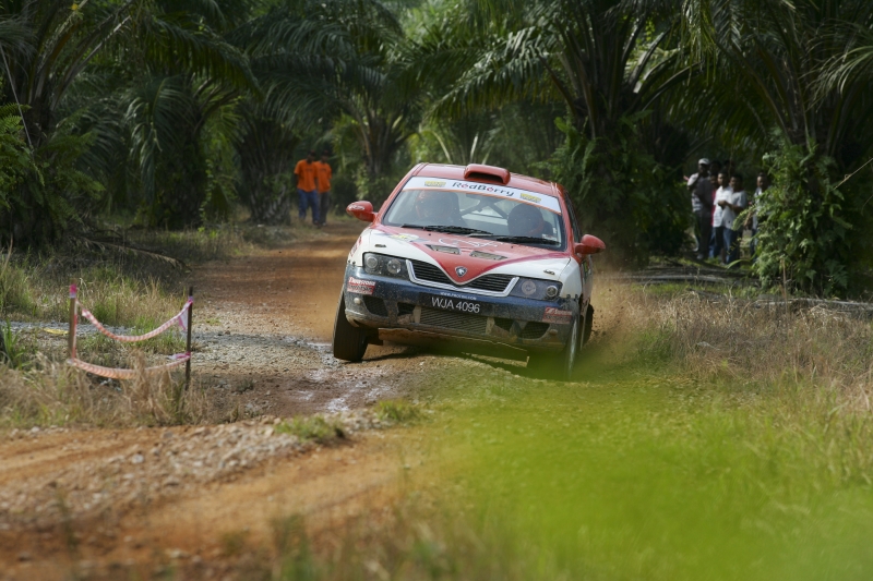 1044425-sepang-cyberjaya-october-31st-rozali-of-the-felda-rally-team-takes-a-corner-during-aam-malaysian-rally-championship-2009-round-4-on-october-31-2009-in-sepang-malaysia